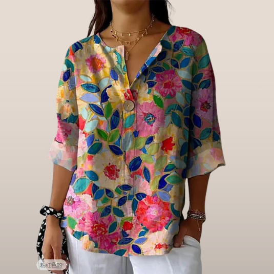 Damesblouse met bloemenprint – Losvallend model en V-hals met knoop