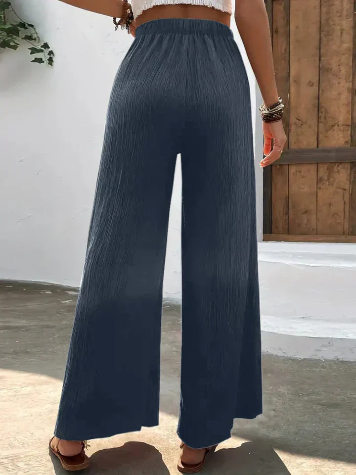 Dames broek – Wijde plissébroek met elastische tailleband